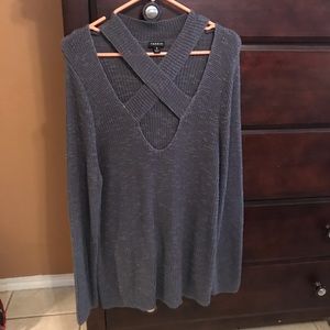 Gray knit sweater.